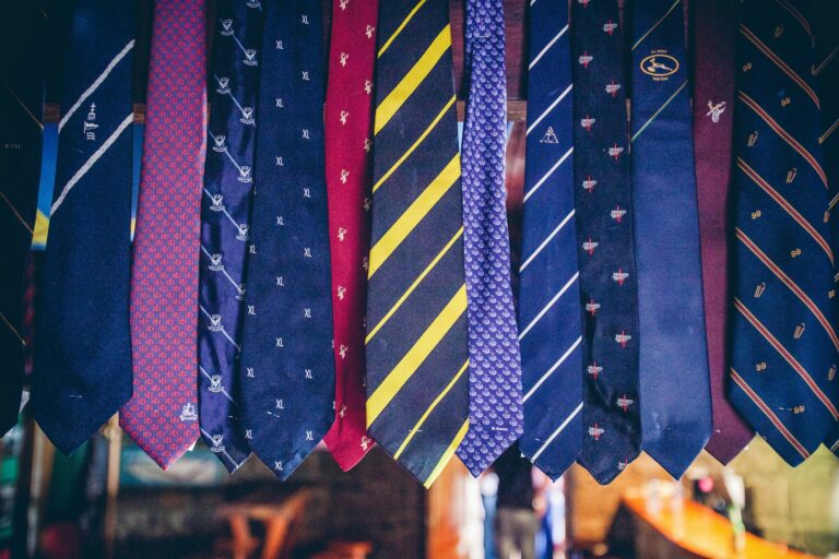 Collection of ties of various sizes, colors, and patterns.